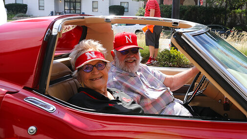 Husker fans enjoy the Drive-thru Tailgate at Wick Alumni Center.