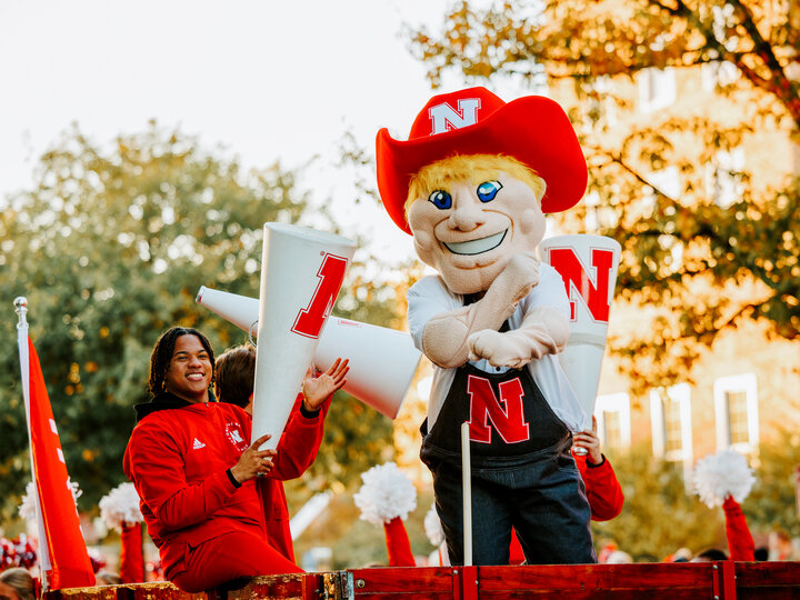 Herbie Husker rides along during the Homecoming Parade.