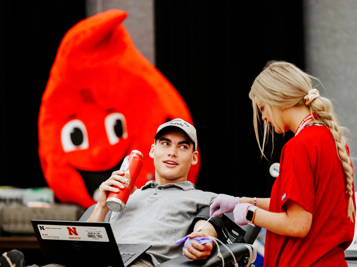 A student gives blood during Homecoming Week.