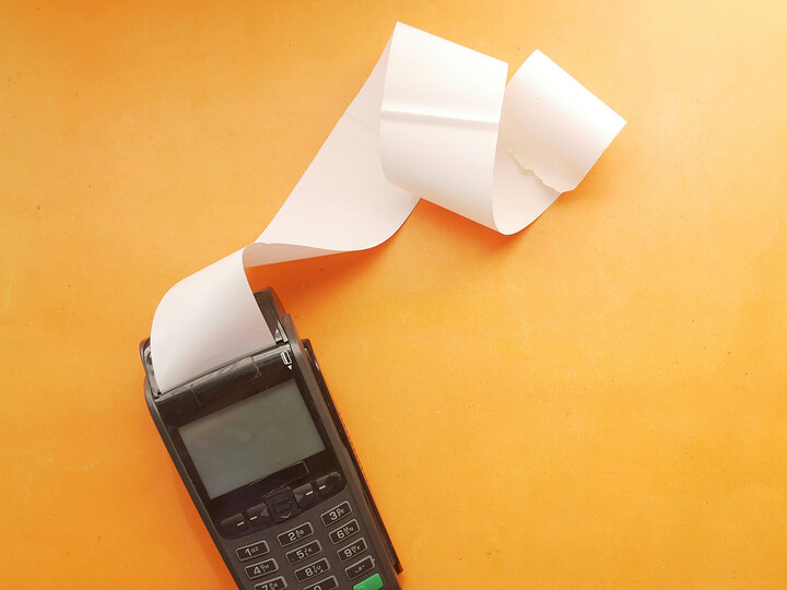 handheld credit card processor with receipt paper [image by towfiqu-barbhuiya | unsplash]