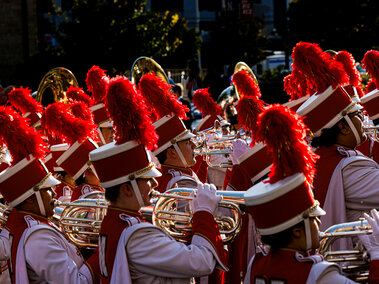 Cornhusker Marching Band performs at the Homecoming Parade.