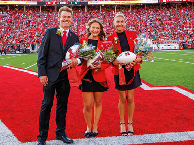 Homecoming royalty winners Caden Connelly, Claire Kelly, and Ava Hollingsworth pose for a photograph during halftime of the Nebraska-Michigan State football game on Oct. 4, 2025.