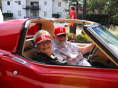 Husker fans enjoy the Drive-thru Tailgate at Wick Alumni Center.